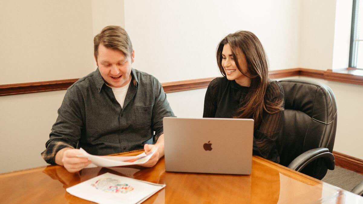 Eric Hersey and Natalie Jeffers of Strong Minded Agency working on client document